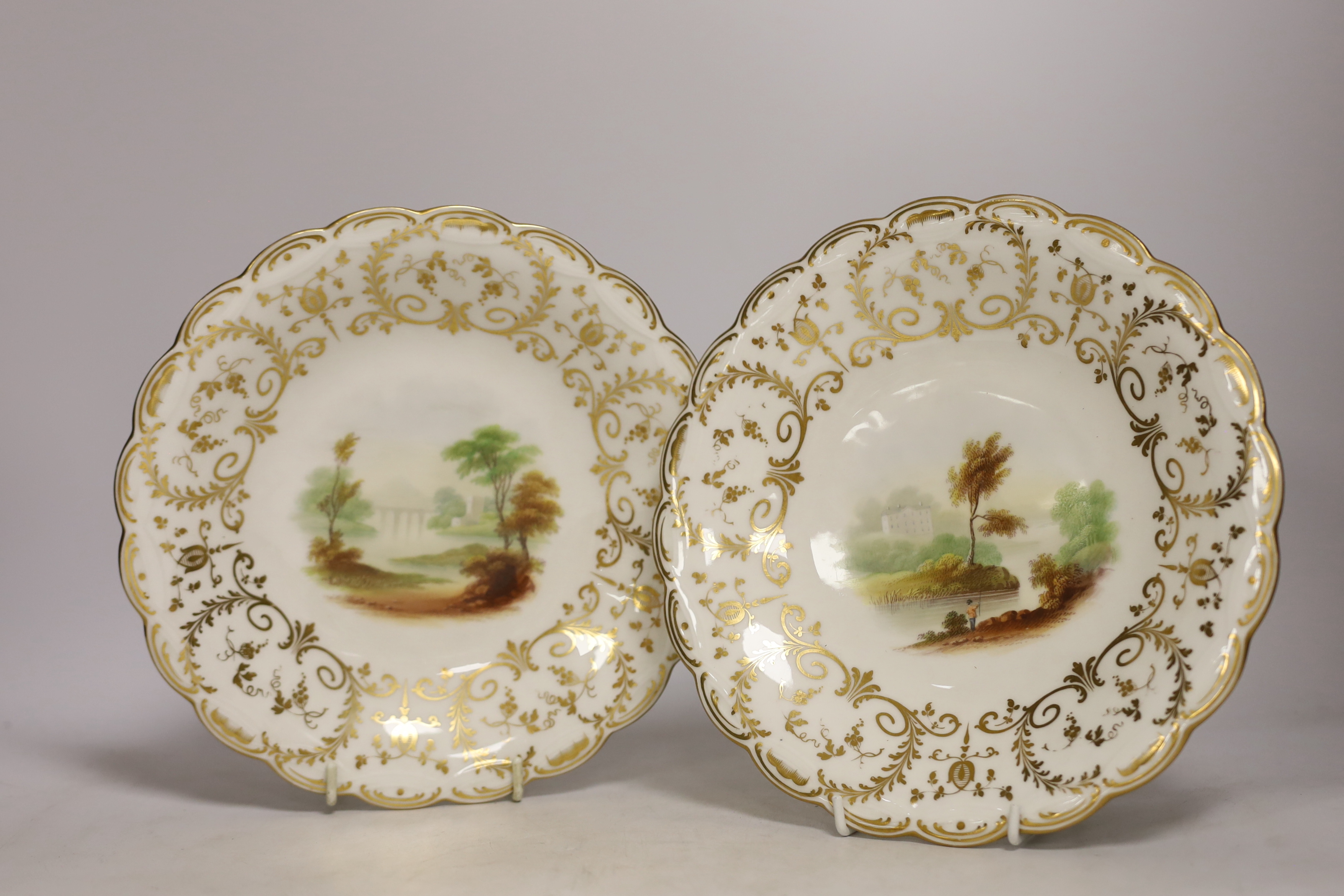 A Minton porcelain landscape painted dessert service, c.1850